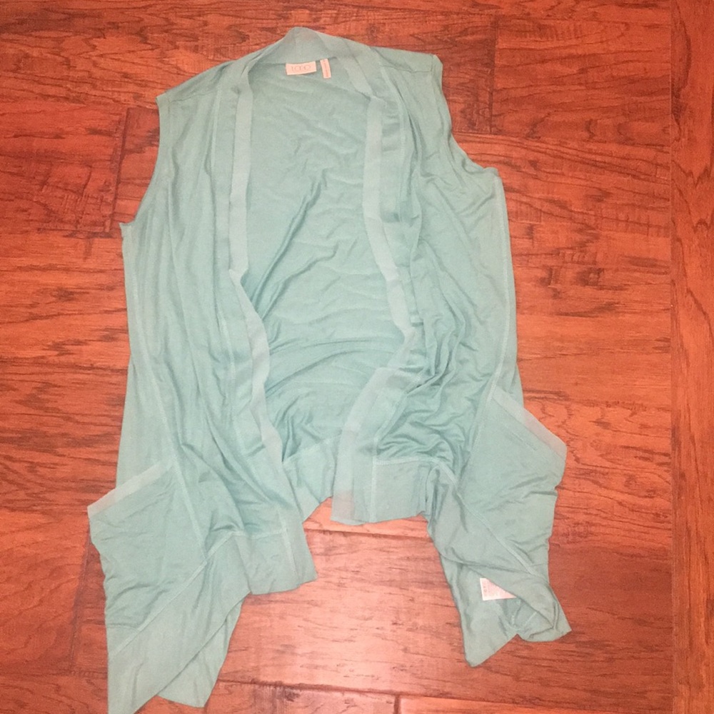 Logo vest. Size small.  Turquoise blue